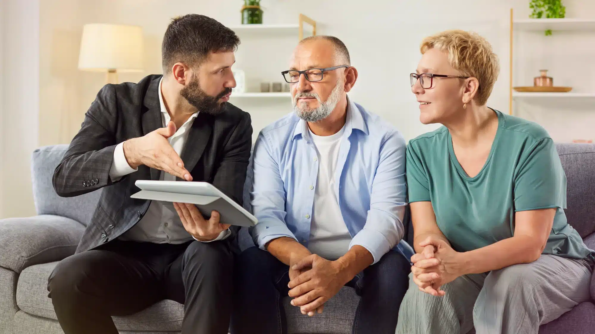 Connecticut homeowners meeting with an insurance agent to review homeowners insurance coverage options and policy recommendations